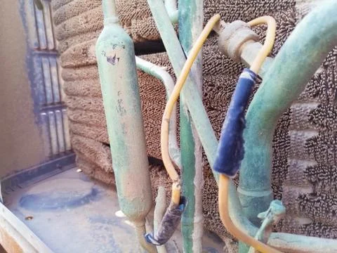Rusty leaking pipe of air conditioning Stock Photos