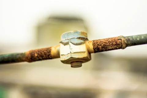 Rusty leaking pipe of air conditioning Stock Photos