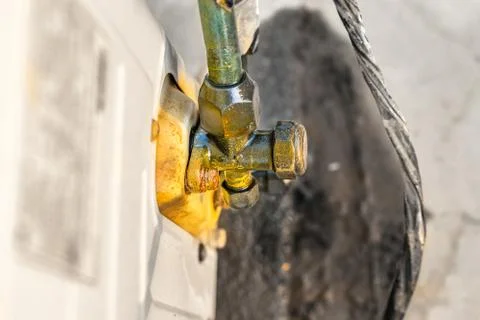 Rusty leaking pipe of air conditioning Stock Photos