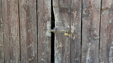 Rusty lock at a barn door Stock Footage 116659211