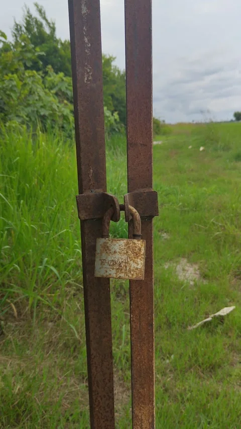 Rusty lock facing the plain Stock Footage 311908002