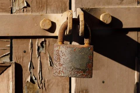 Rusty lock on the gate close-up Stock Photos