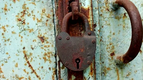 Rusty lock hanging on the door Stock Footage 62931701