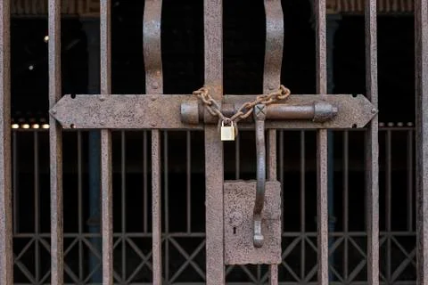 Rusty lock with a padlock closing a gate Stock Photos