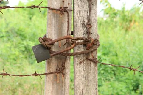 Rusty locked with sling Stock Photos