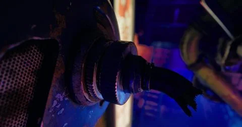 Rusty machine part in low light revealing textures and colors of decay Illustrazione stock