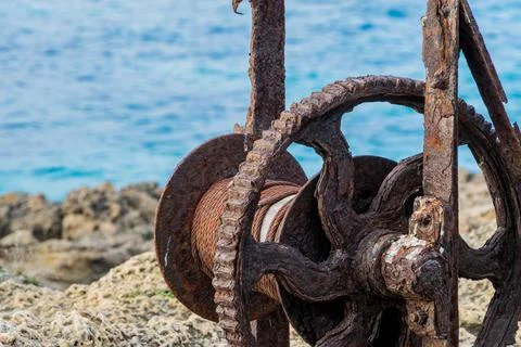 Rusty machine on the seashore Stock Photos