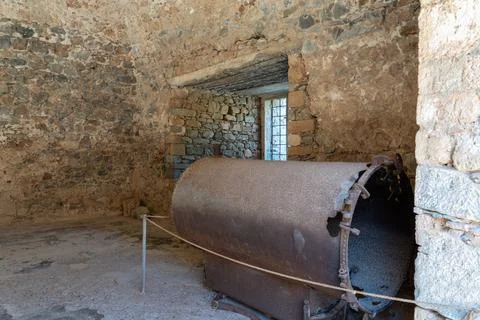 Rusty Machinery Inside Historical Stone Building on Spinalonga Island Stock-Fotos