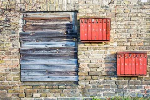 Rusty mailboxes on the brick grunge wall Stock Photos