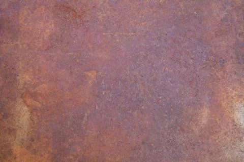 Rusty metal background with flaking and pitted corrosion Stock Photos