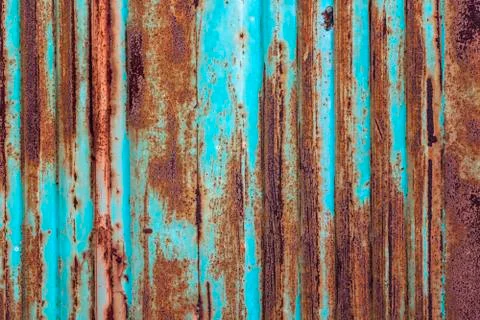 Rusty metal background with old layers of blue paint. Texture rusted shipping Stock Photos