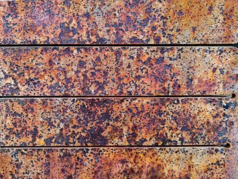 Rusty metal background with rough texture Stock Photos