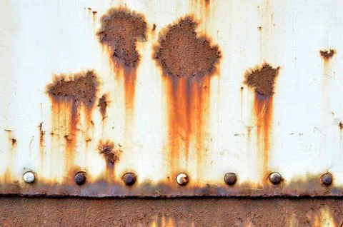 Rusty metal background with streaks of rust. Rust stains. Stock Photos