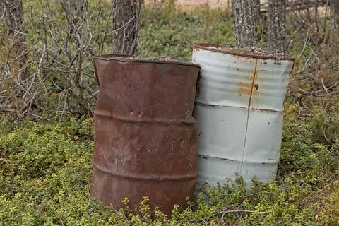 Rusty metal drums. 스톡 사진
