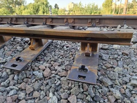 Rusty metal elements of rail system Stock Photos