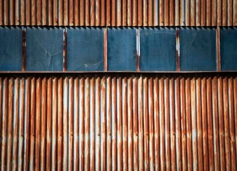 A rusty metal gate with windows Stock Photos