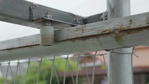 Rusty metal guide bracket with bearing rollers for sliding gate. Stock Footage 155367666