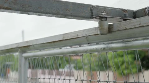 Rusty metal guide bracket with bearing rollers for sliding gate. Stock Footage 165682081