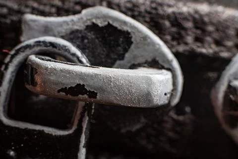Rusty metal hook with detailed texture and dark background highlights nature of Stock Photos