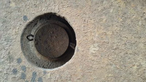 Rusty metal with a large hole. The Texture Of The Metal. background. Stock Photos