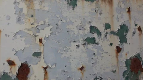Rusty metal macro chipped paint and stains abstract background slow motion Stock Footage 252083330