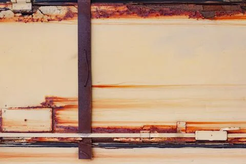 Rusty metal orange colored panel texture. Stock Photos