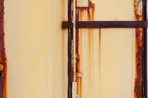 Rusty metal orange colored panel texture. Stock Photos