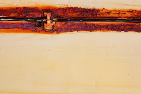 Rusty metal orange colored panel texture. Stock Photos