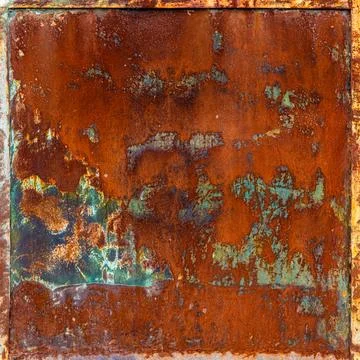 Rusty metal panel with frame and peeling green paint leftovers Stock Photos