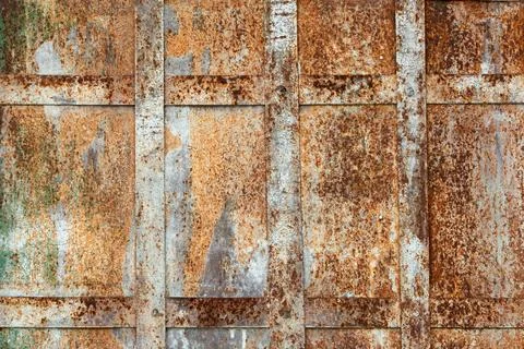 Rusty metal panels with grid pattern display expressive texture and vintage Stock Photos