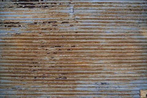 Rusty metal ribbed sheet texture, rusty garage door Stock Photos