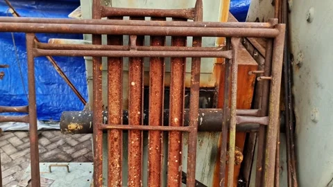 ​Rusty Metal Scaffolding Frames Stacked at a Construction Site Yard 스톡 동영상 347699253