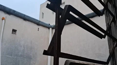 Rusty metal security bars protecting window in motion video footage Stock Footage 339505174