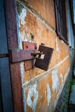 Rusty Metal Security Lock on Brick Wall limited access internet security Concept Stock Photos