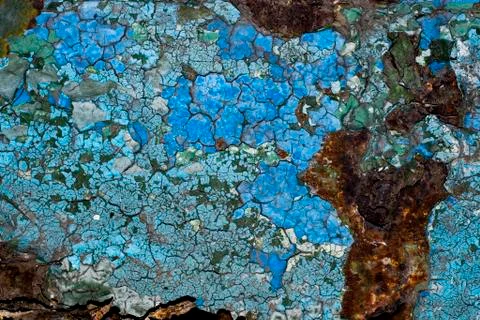 Rusty metal surface with blue paint flaking and cracking texture Stock Photos