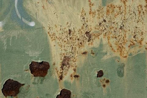 Rusty metal surface with colored paint flaking and cracking texture Stock Photos