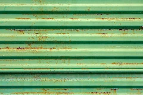 Rusty metal surface painted in green Stock Photos