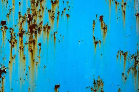 Rusty metal surface with peeling paint in industrial setting Фото