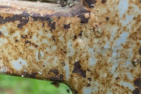 Rusty metal surface with peeling paint and textured details Stock Photos