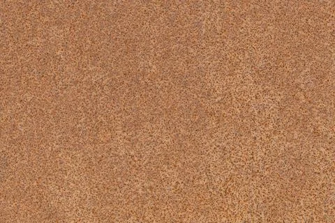 Rusty metal surface with speckled texture and pattern. Stock Photos