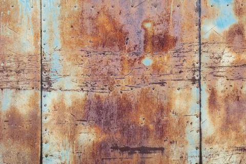 Rusty metal texture background, old scratched iron wall with seams and rivets Stock Photos