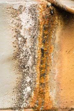 Rusty metal texture background with a weld seam. Stock Photos