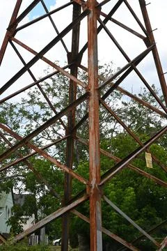 Rusty metal tower against cloudy sky Stock Photos