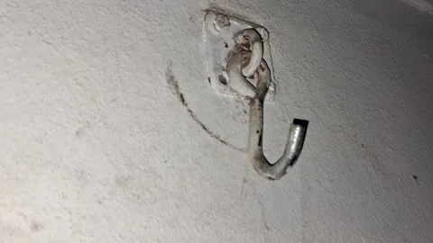 Rusty metal wall hook spinning Video stock 346250994