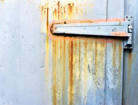 Rusty metallic hinge on door Stock Photos