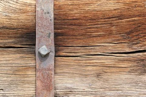 Rusty metallic mount on oak beam, beautiful wooden texture Stock Photos