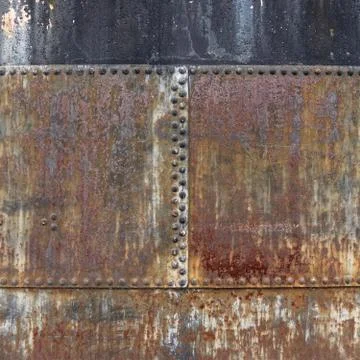 Rusty metallic surface with bolt heads Stock Photos