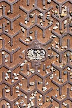 Rusty metallic textured surface with lots of pebbles Stock Photos
