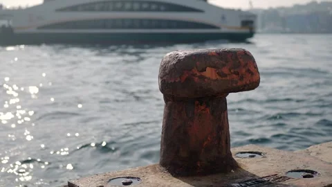 A Rusty Mooring Cleat Found on the Waterfront Accompanied by Sparkling Water Stock Footage 288058652