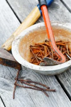 Rusty nails and nail puller close-up Stock Photos